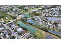 Bird's eye view of a house and neighborhood with lakes at 4519 Trout River Xing, Ellenton, FL 34222