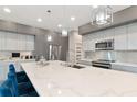 Modern kitchen with stainless steel appliances and a large island at 4917 Sabal Lake Cir, Sarasota, FL 34238