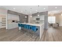 Modern kitchen with stainless steel appliances and a large island at 4917 Sabal Lake Cir, Sarasota, FL 34238