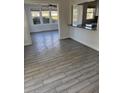 Bright dining room with wood-look tile floor and sunroom access at 506 Houle Ave, Sarasota, FL 34232