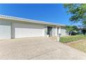 Attractive villa featuring a two-car garage and well-manicured landscaping at 6704 11Th W Ave, Bradenton, FL 34209