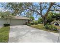 Attached garage with a long driveway at 7340 Silver Fern Blvd # 5, Sarasota, FL 34241