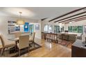 Open living area with hardwood floors and exposed beams at 7340 Silver Fern Blvd # 5, Sarasota, FL 34241