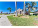 Two-story house with three-car garage and palm trees at 11306 77Th E St, Parrish, FL 34219