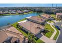 Community overview showcasing houses near a lake at 11467 Conch Ct, Venice, FL 34292