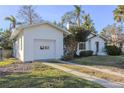 White single car garage with driveway at 116 23Rd W St, Bradenton, FL 34205