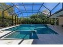 Inviting swimming pool with a spa and covered patio at 1237 Flying Bridge Ln, Osprey, FL 34229