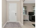 Bright entryway with tile floors and a view into the living area at 17633 Cantarina Cv, Bradenton, FL 34211