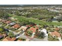 Property view showcasing a golf course and community setting at 1985 White Feather Ln, Nokomis, FL 34275