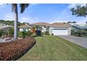 One-story house with a well-maintained lawn and attractive facade at 1985 White Feather Ln, Nokomis, FL 34275