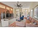 Spacious living area featuring a neutral color palette and ample natural light at 1985 White Feather Ln, Nokomis, FL 34275