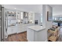 Modern white kitchen with stainless steel appliances at 20 Whispering Sands Dr # 306, Sarasota, FL 34242