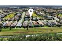 Aerial view showing the house's location in a residential community at 204 Venice Palms Blvd, Venice, FL 34292