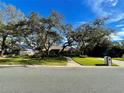 House with a large yard, mature trees and a mailbox at 2704 Barret Ave, Plant City, FL 33566