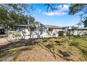 Gray house with a fenced yard and landscaping at 2925 29Th W Ave, Bradenton, FL 34205