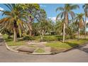 Landscaped corner lot with lush tropical plants at 349 Scott Ave, Sarasota, FL 34243