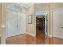 Bright entryway with double doors and hardwood floors at 3861 Royal Hammock Blvd, Sarasota, FL 34240