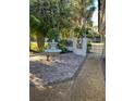 Charming courtyard with a fountain and brick-paved patio at 4839 Primrose Path, Sarasota, FL 34242