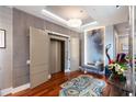 Elegant building entry with elevator access and modern decor at 540 N Tamiami Trl # 702, Sarasota, FL 34236
