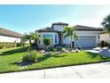 Single-story home with a grey garage door and landscaped front yard at 5593 Piccolo St, Nokomis, FL 34275