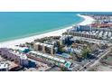 Aerial view of beach front property and community at 6424 Midnight Pass Rd # 12A, Sarasota, FL 34242