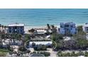 Aerial view of beachfront home near ocean at 6501 Gulf Of Mexico Dr, Longboat Key, FL 34228
