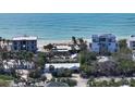 Aerial view of beachfront homes and construction at 6501 Gulf Of Mexico Dr, Longboat Key, FL 34228