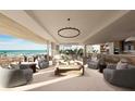Open-concept living space with ocean views and modern kitchen at 70 Avenida Veneccia # 204, Sarasota, FL 34242