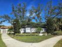 Community entrance sign for Heron Landing with landscaping and walkway at 7228 Great Egret Blvd, Sarasota, FL 34241