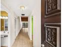 View down a condo entry hallway into living area at 7505 4Th W Ave # 7505, Bradenton, FL 34209