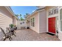 Private brick patio with bistro set, perfect for relaxing at 7741 Whitebridge Gln, University Park, FL 34201