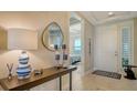 Elegant entryway with console table and a view of the bedroom at 10510 Boardwalk Loop # 404, Lakewood Ranch, FL 34202