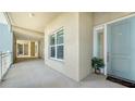 Bright hallway with light walls and a modern door at 10510 Boardwalk Loop # 404, Lakewood Ranch, FL 34202