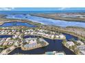 Wide shot of waterfront community with homes and waterways at 11124 Sanctuary Dr, Bradenton, FL 34209