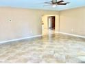 Bright living room with tile floors and a view into the kitchen at 1414 6Th W St, Palmetto, FL 34221