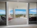 Spacious balcony with water views and comfortable seating at 2050 Benjamin Franklin Dr # A601, Sarasota, FL 34236