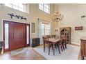 Elegant dining room with a large table, chandelier, and hardwood floors at 223 Heritage Isles Way, Bradenton, FL 34212