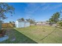 Large backyard with detached shed, offering ample outdoor space at 2807 W 52Nd Ter, Bradenton, FL 34207