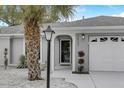 Inviting front entrance with updated door and landscaping at 3822 75Th E Ter, Sarasota, FL 34243