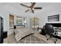 Bright bedroom with a built-in workspace and access to backyard at 4679 Country Manor Dr, Sarasota, FL 34233