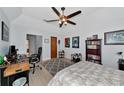 Cozy bedroom with a desk setup and ample closet space at 4679 Country Manor Dr, Sarasota, FL 34233