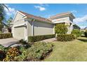 Two-story house with two-car garage and neatly trimmed hedges at 4891 Maymont Park Cir, Bradenton, FL 34203