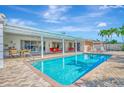 Inviting swimming pool with a spacious patio area at 531 N Spoonbill Dr, Sarasota, FL 34236