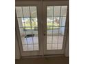 French doors leading to a patio with a view at 5345 Pamela Wood Way, Sarasota, FL 34233