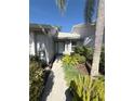 Front entry with landscaped walkway at 5345 Pamela Wood Way, Sarasota, FL 34233