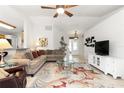 Open living room showcasing neutral tones and ample natural light at 6950 42Nd E Ct, Sarasota, FL 34243