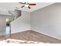 Living room with hardwood floors and staircase at 7560 Plantation Cir, Bradenton, FL 34201