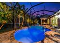 Night view of a beautiful pool and spa at 854 Rosemary Cir, Bradenton, FL 34212