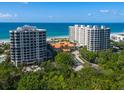 Aerial view of two luxury beachfront condominium buildings at 1281 Gulf Of Mexico Dr # 404, Longboat Key, FL 34228