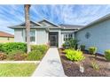 Welcoming entryway with landscaped gardens and a charming walkway at 12904 49Th E Ln, Parrish, FL 34219